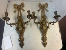 pair of metal wall sconces with cherubs