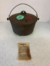 Three legged cast-iron Dutch oven
