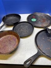 Five pieces of cast-iron cookware