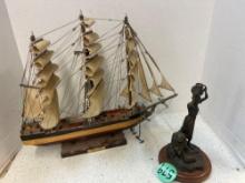 Cutty Shark model ship and woman at the well bronze statue