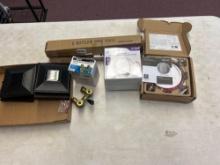 smoke and carbon monoxide alarms, washing machine valves, eight bottle wine rack, and solar lights