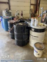 Lot of barrels: oils, fluids, grease, diesel additive, coolant & more assorted products.