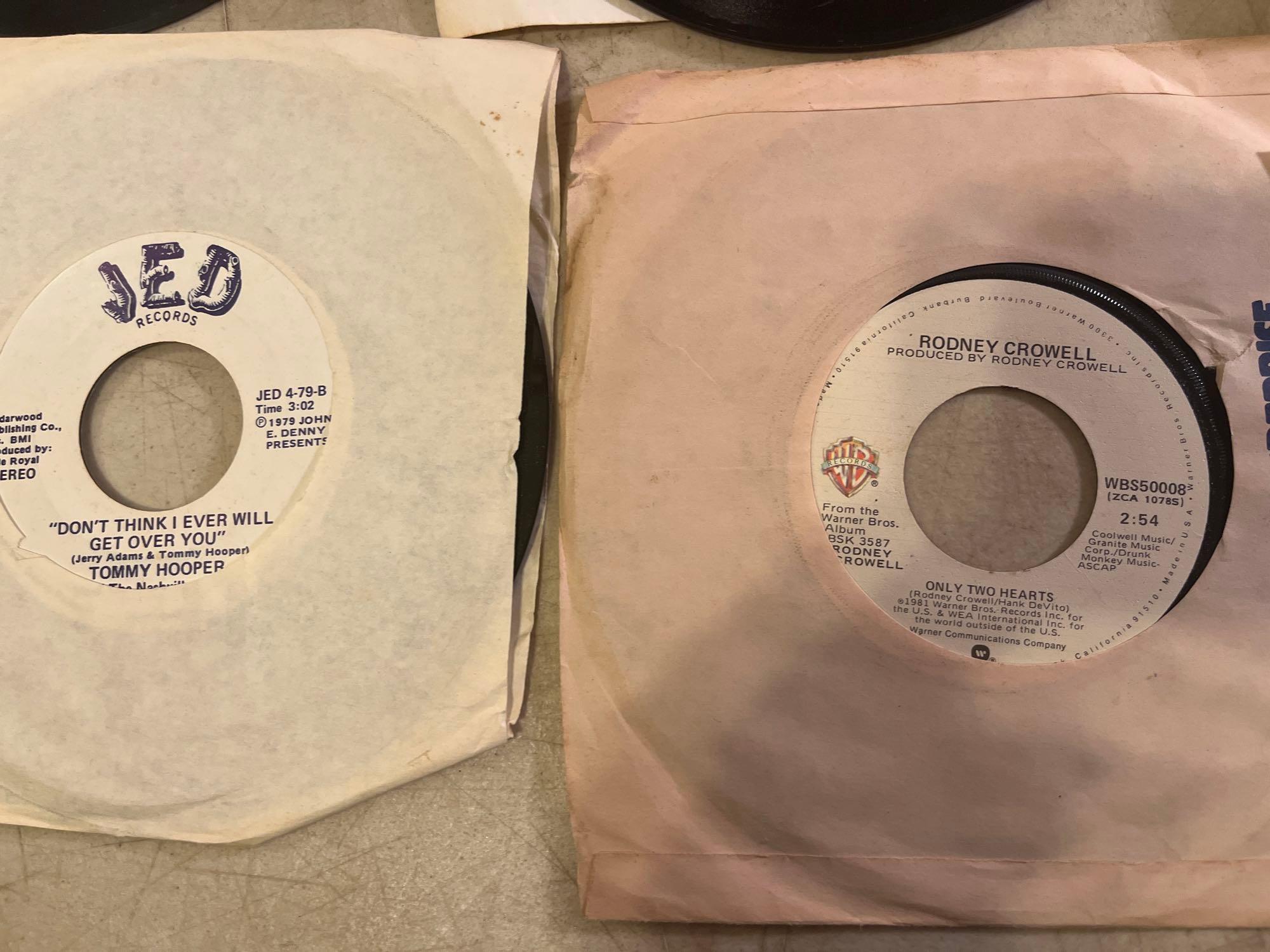 Eleven 45 rpm Records