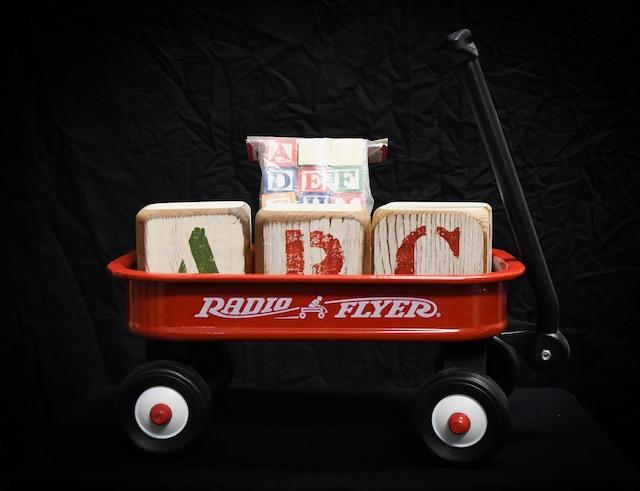 Radio Flyer wagon with wooden ABC blocks