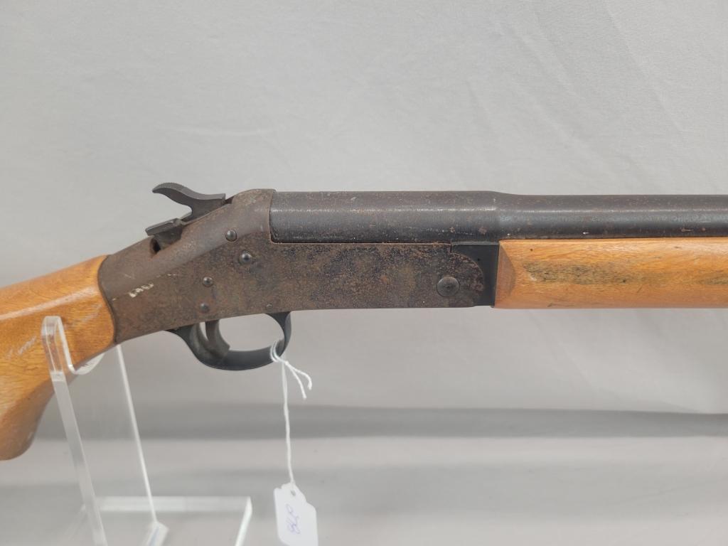 H&R Topper Shotgun H&R Topper single shot shotgun, chambered in 12 ga, wooden stock and blued barrel