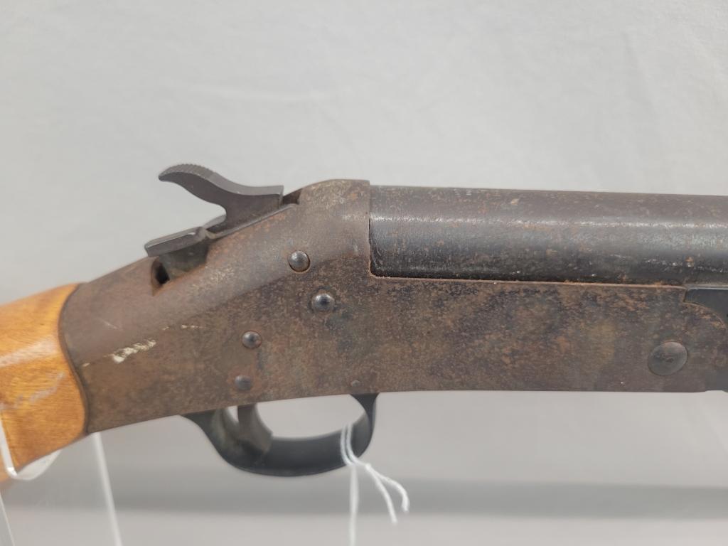 H&R Topper Shotgun H&R Topper single shot shotgun, chambered in 12 ga, wooden stock and blued barrel