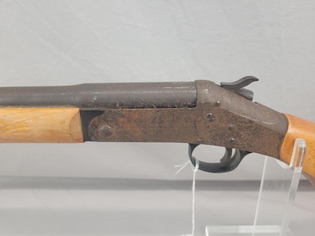 H&R Topper Shotgun H&R Topper single shot shotgun, chambered in 12 ga, wooden stock and blued barrel