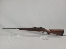 Tikka Model T3 Rifle Tikka model T3 rifle, chambered in 338 Fed, wooden stock and blued barrel and r