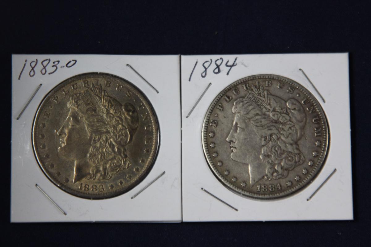 2 Morgan dollars: 1883 O, 1884