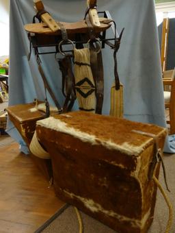 Crossbuck pack saddle with Hereford hide-covered pack saddles