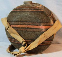 Brass bed warmer and wool covered canteen