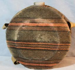 Brass bed warmer and wool covered canteen