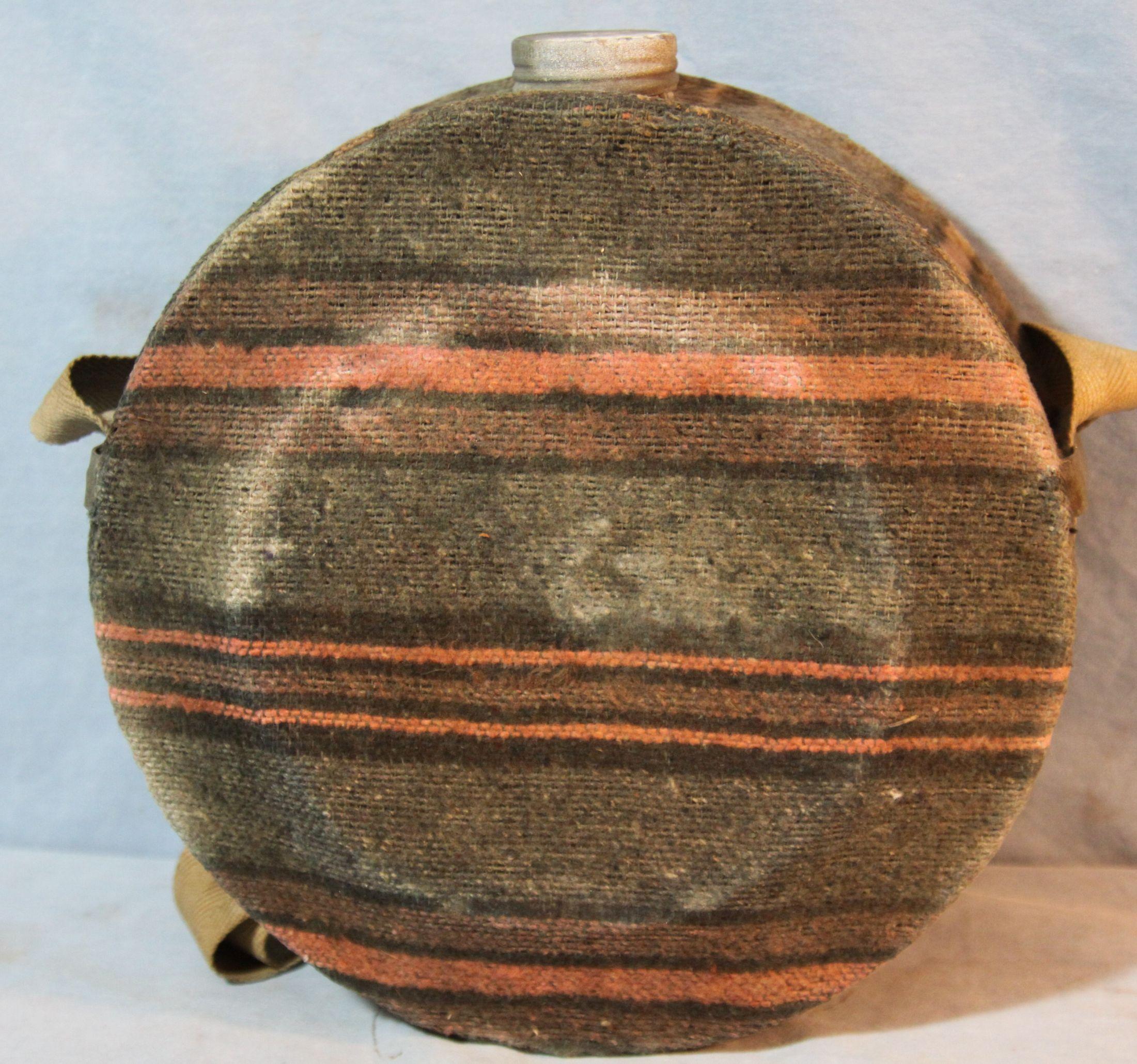 Brass bed warmer and wool covered canteen