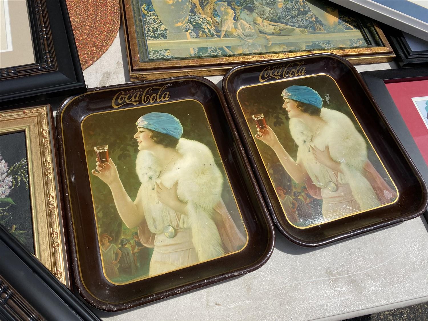 Table lot of assorted framed art, Coca Cola trays, paintings