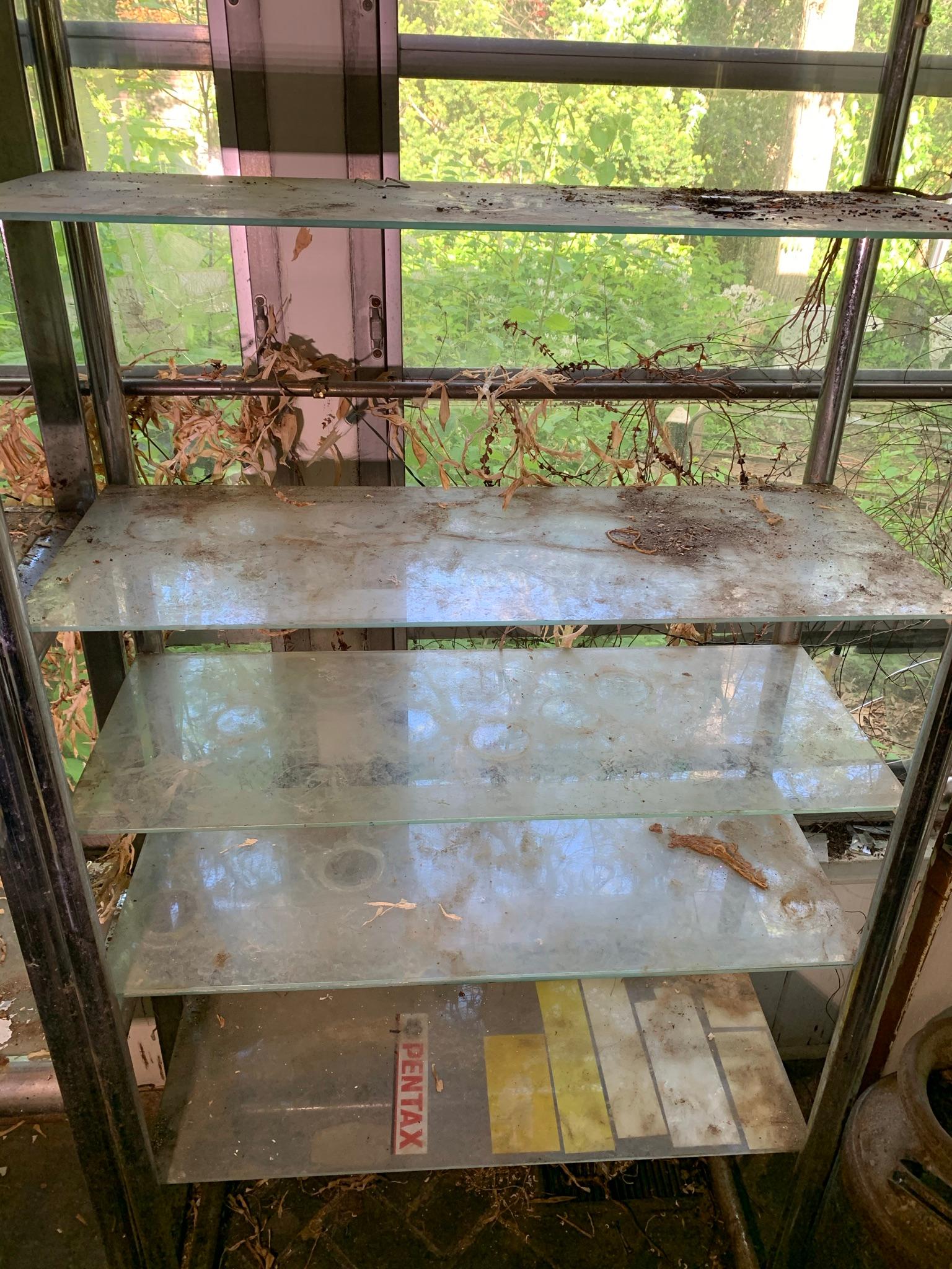 2 Chrome and Glass Shelving Units.  See Photos..