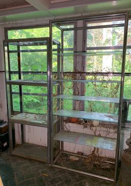 2 Chrome and Glass Shelving Units.  See Photos..