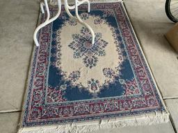 Glass top table and rug