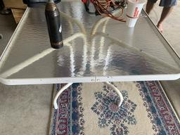 Glass top table and rug