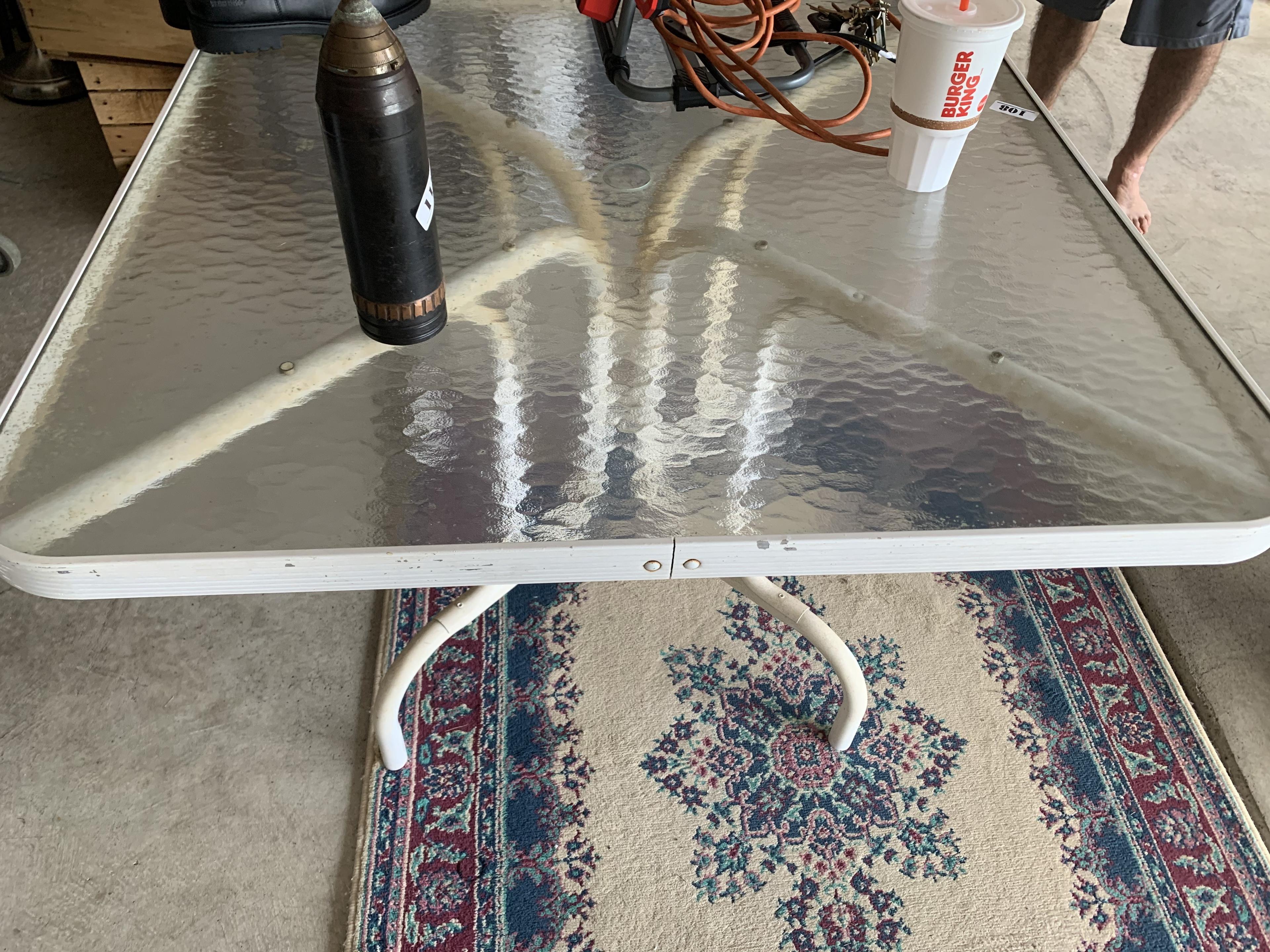 Glass top table and rug