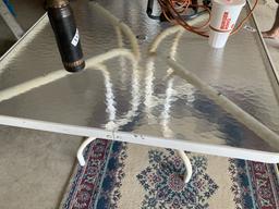 Glass top table and rug