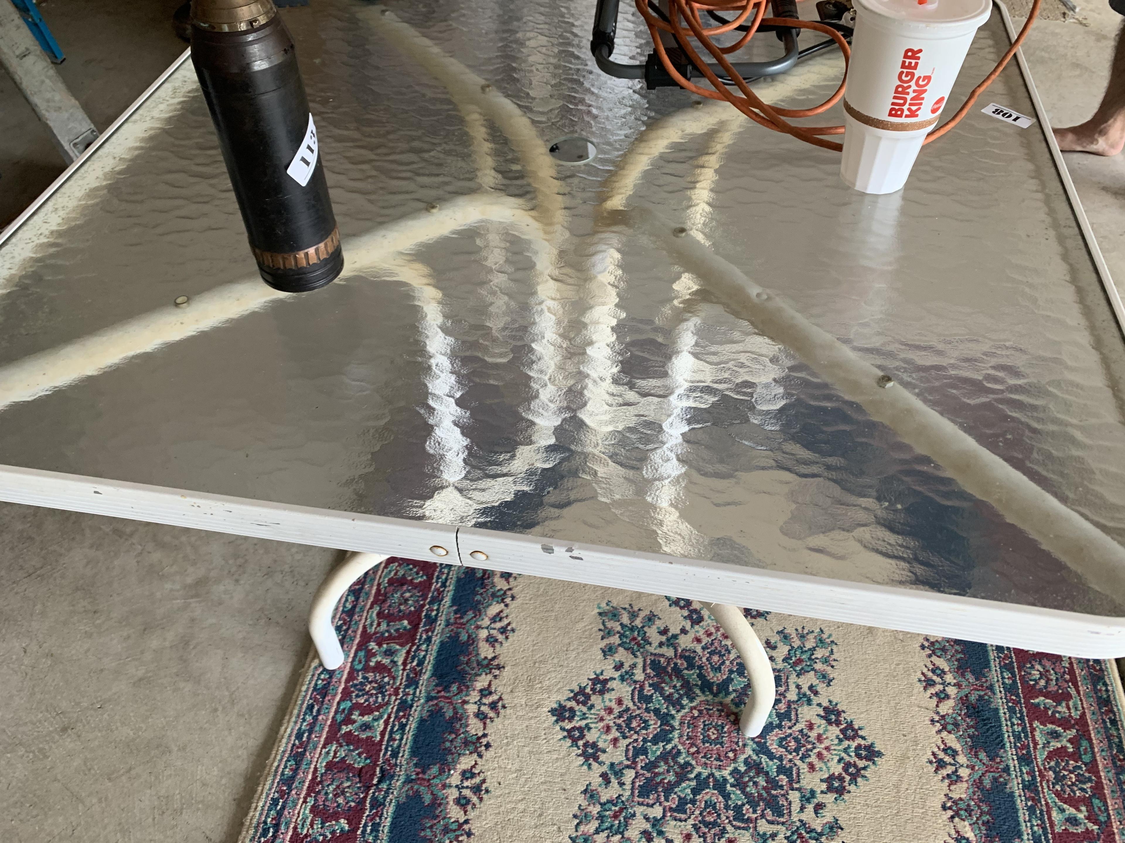 Glass top table and rug