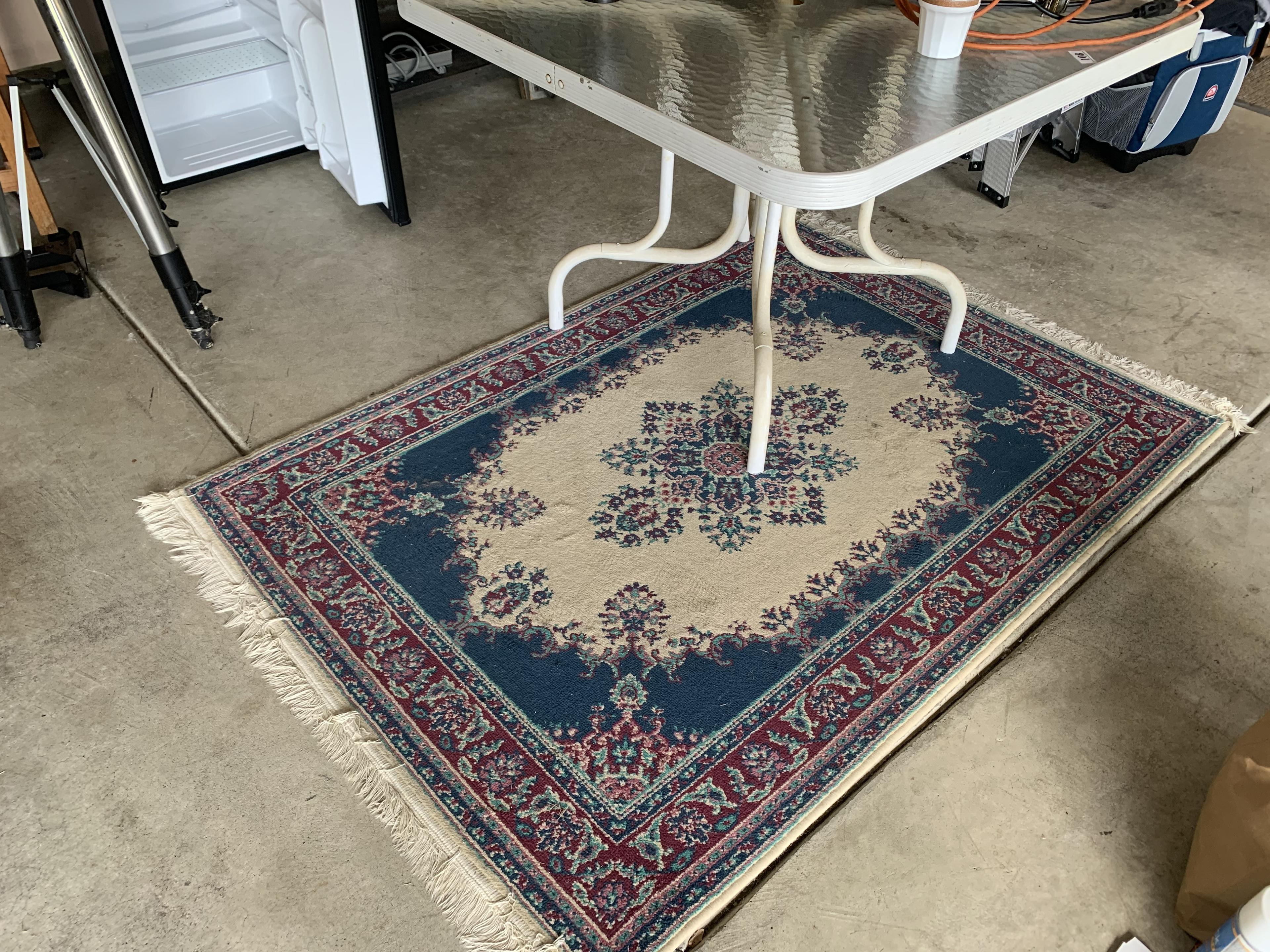 Glass top table and rug