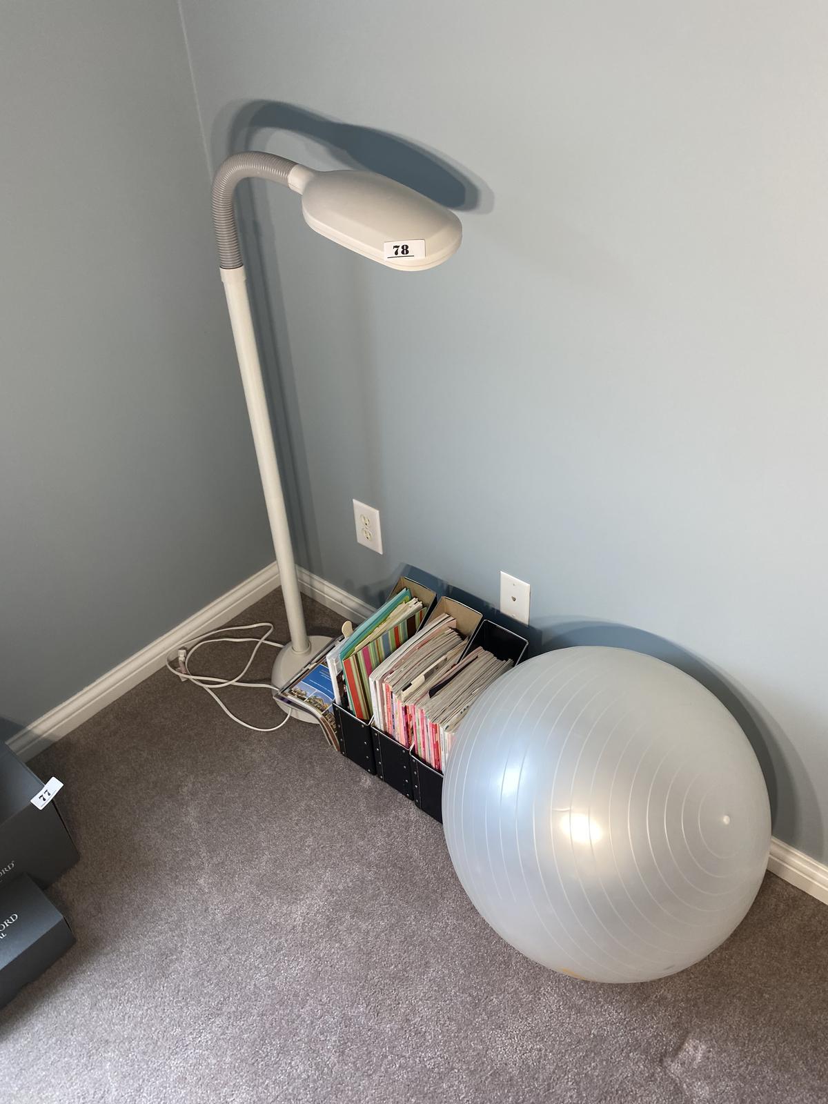 Lamp, magazines, exercise ball.