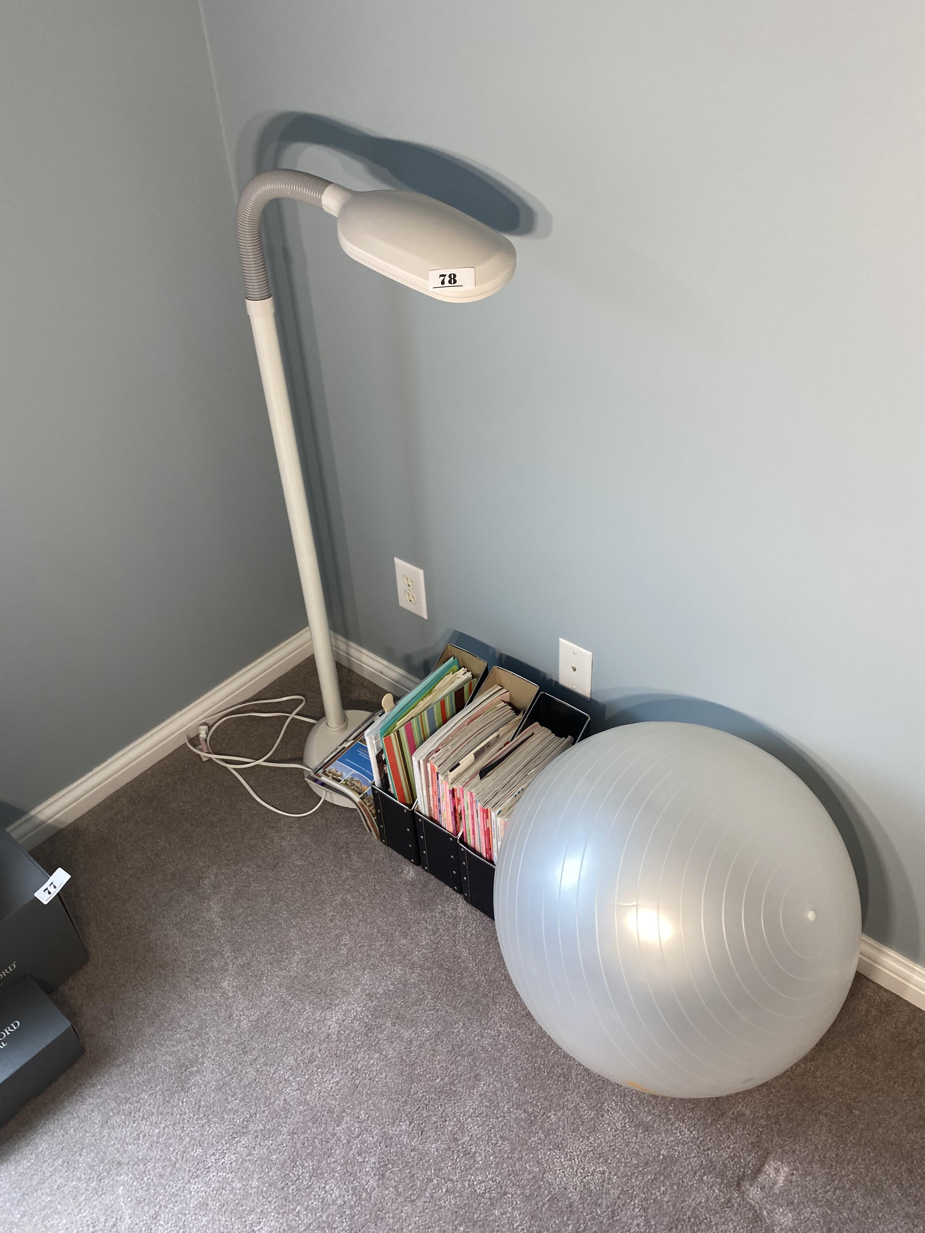 Lamp, magazines, exercise ball.