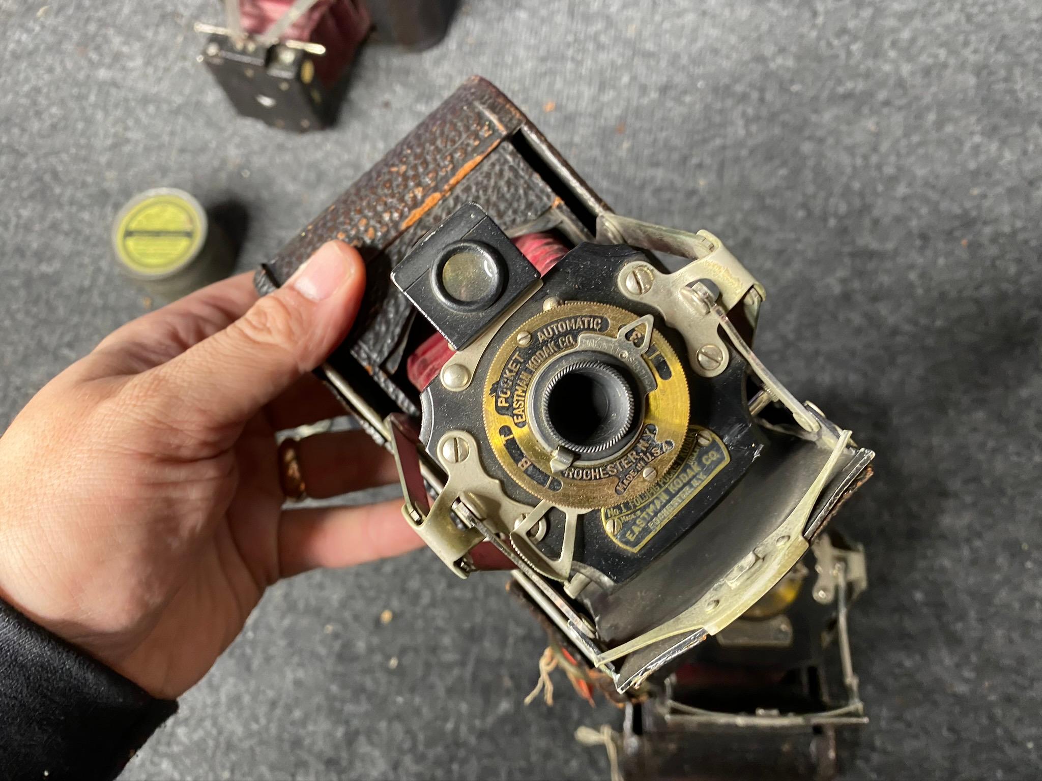 Group lot of folding cameras and accessories