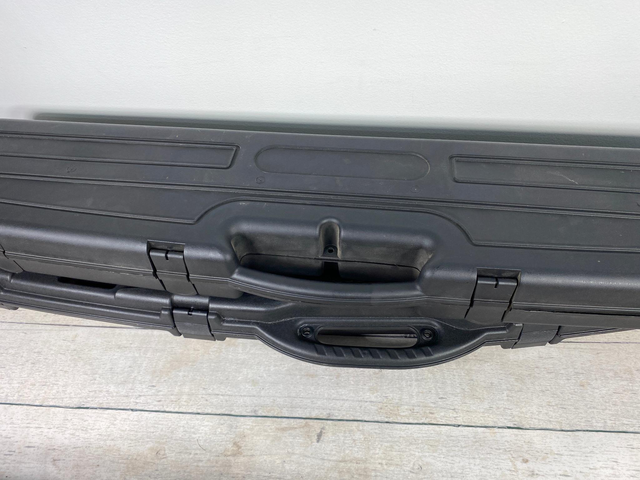 Three plastic rifle cases