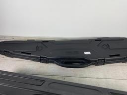 Three plastic rifle cases