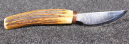 C. Cox 1/94 custom 3.5" approx. fixed blade knife with antler handle in leather sheath