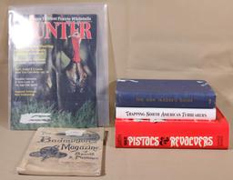 lot of books, "The Gun Trader's Guide", "Trapping