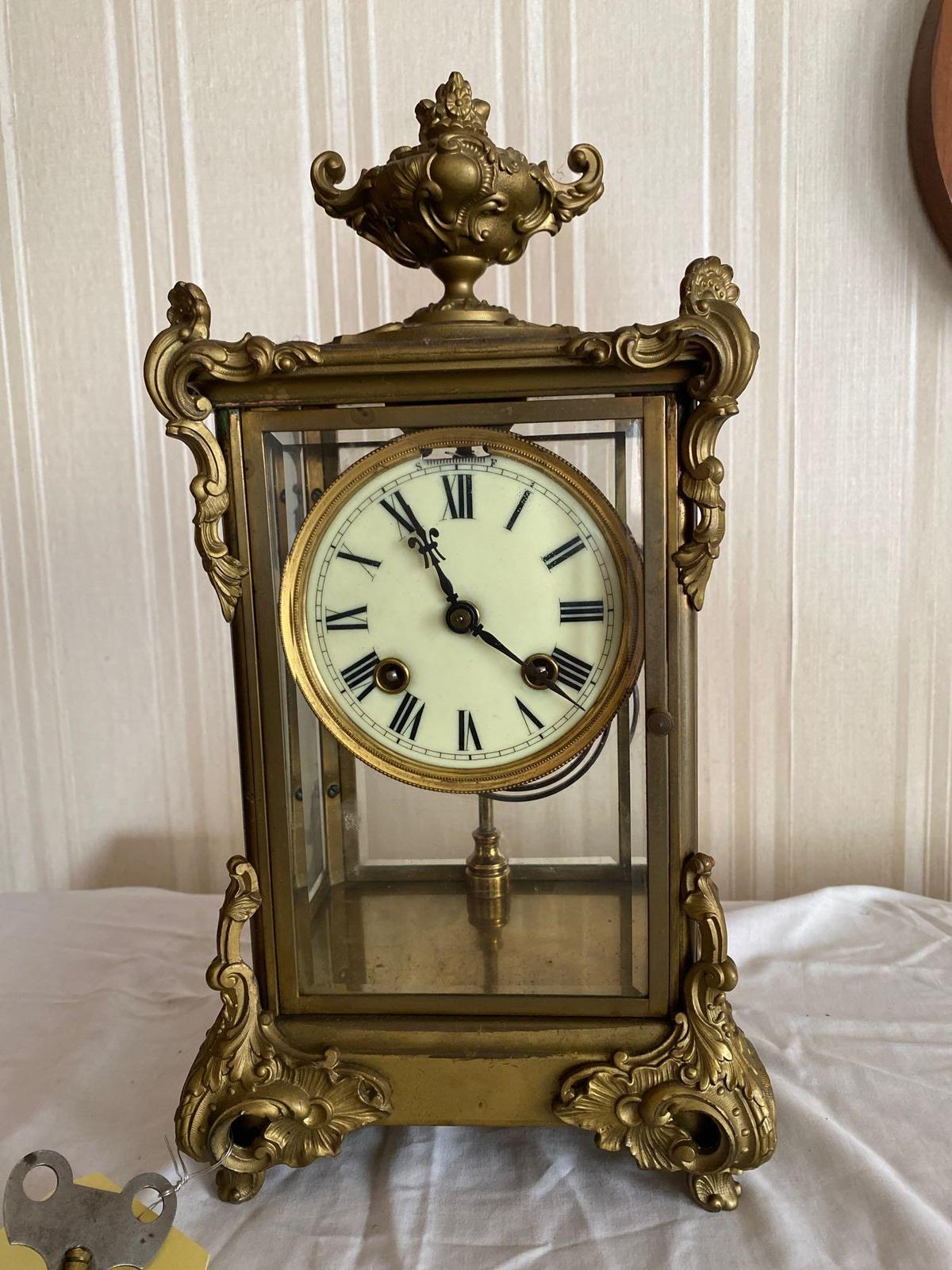 Ansonia crystal regulator clock with watch escapement. Unusual in that it needs no pendulum.