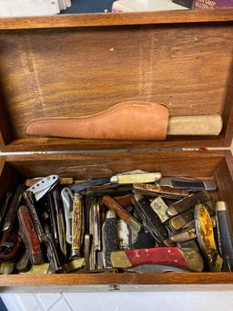 Wooden tote of pocket knives