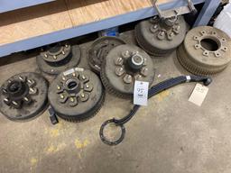 Assorted trailer drum hubs, some new, leaf spring