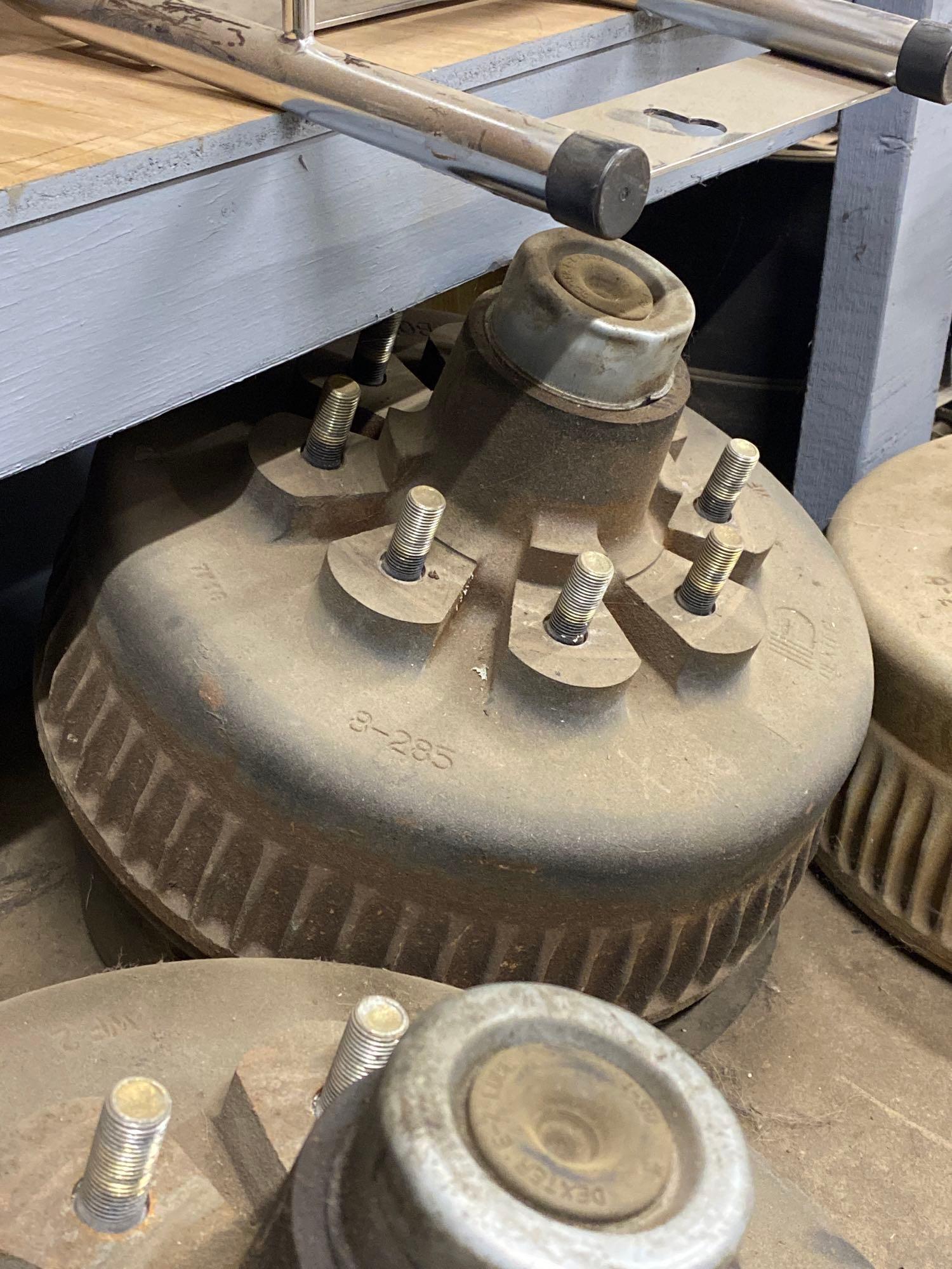 Assorted trailer drum hubs, some new, leaf spring