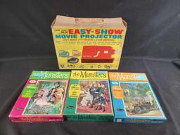 3 1965 Whitman The Munsters jigsaw puzzles complete and Chad Valley batt op movie projectorl