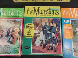 3 1965 Whitman The Munsters jigsaw puzzles complete and Chad Valley batt op movie projectorl