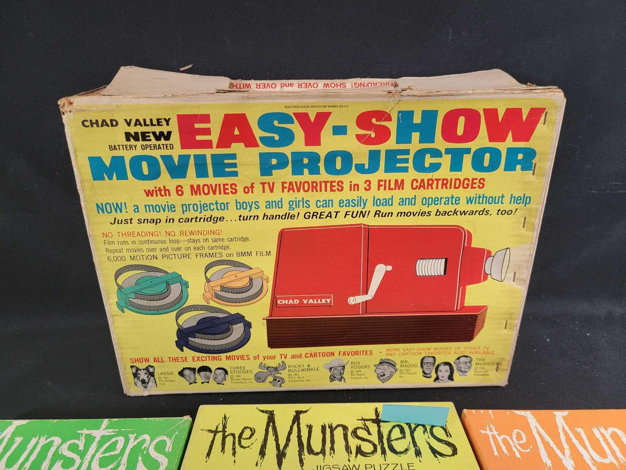 3 1965 Whitman The Munsters jigsaw puzzles complete and Chad Valley batt op movie projectorl