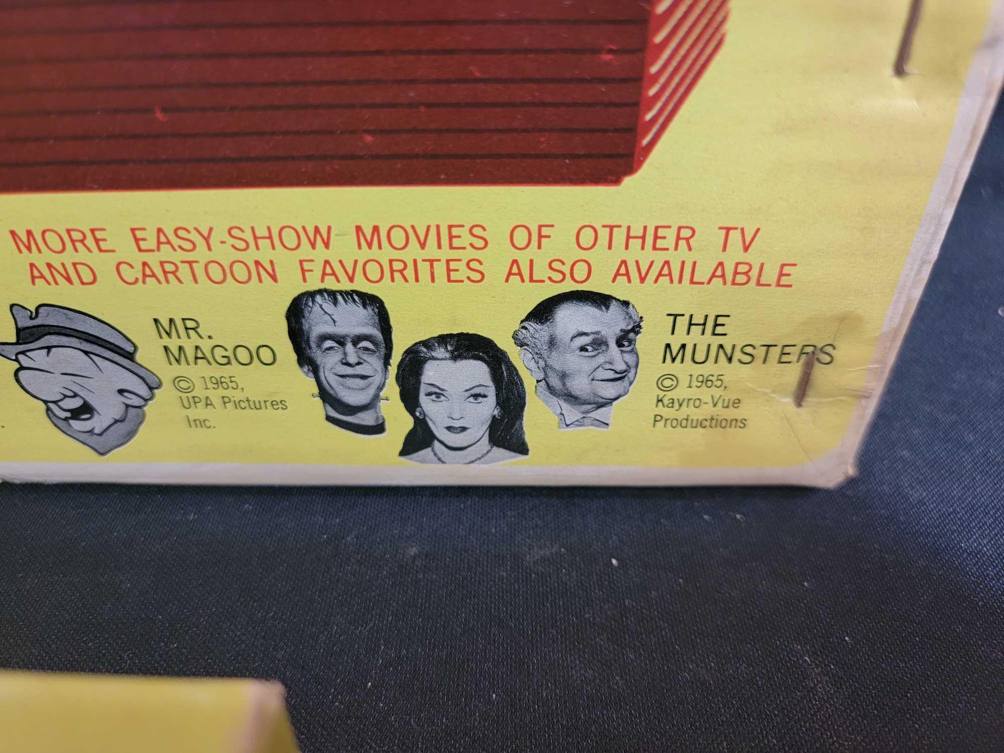 3 1965 Whitman The Munsters jigsaw puzzles complete and Chad Valley batt op movie projectorl