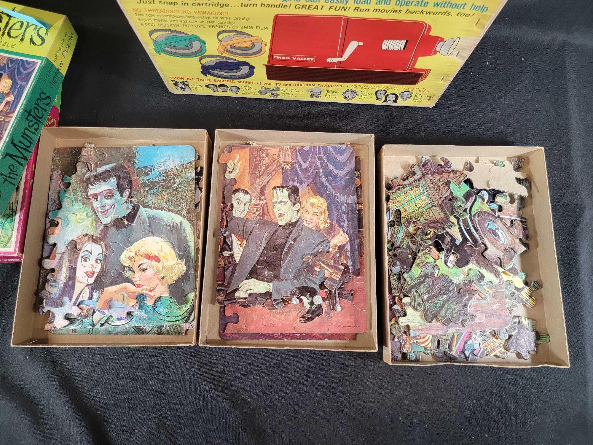 3 1965 Whitman The Munsters jigsaw puzzles complete and Chad Valley batt op movie projectorl