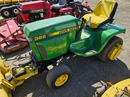 John Deere 322 mower with blade and deck