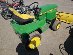 John Deere 322 mower with blade and deck