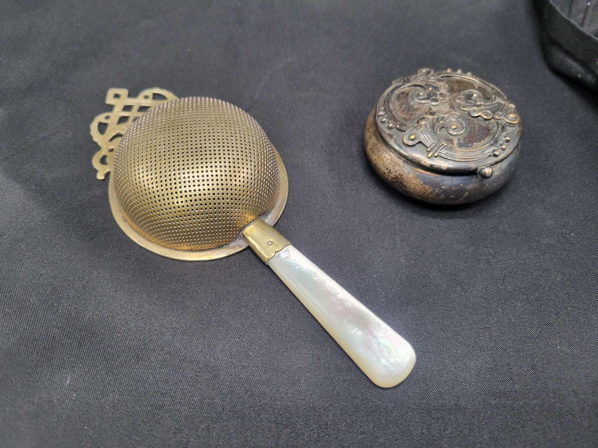 Small antique sterling top shakers, England strainer with mother of pearl handle, cape fastener
