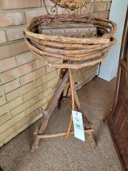 Bent wood stand with artificial plant