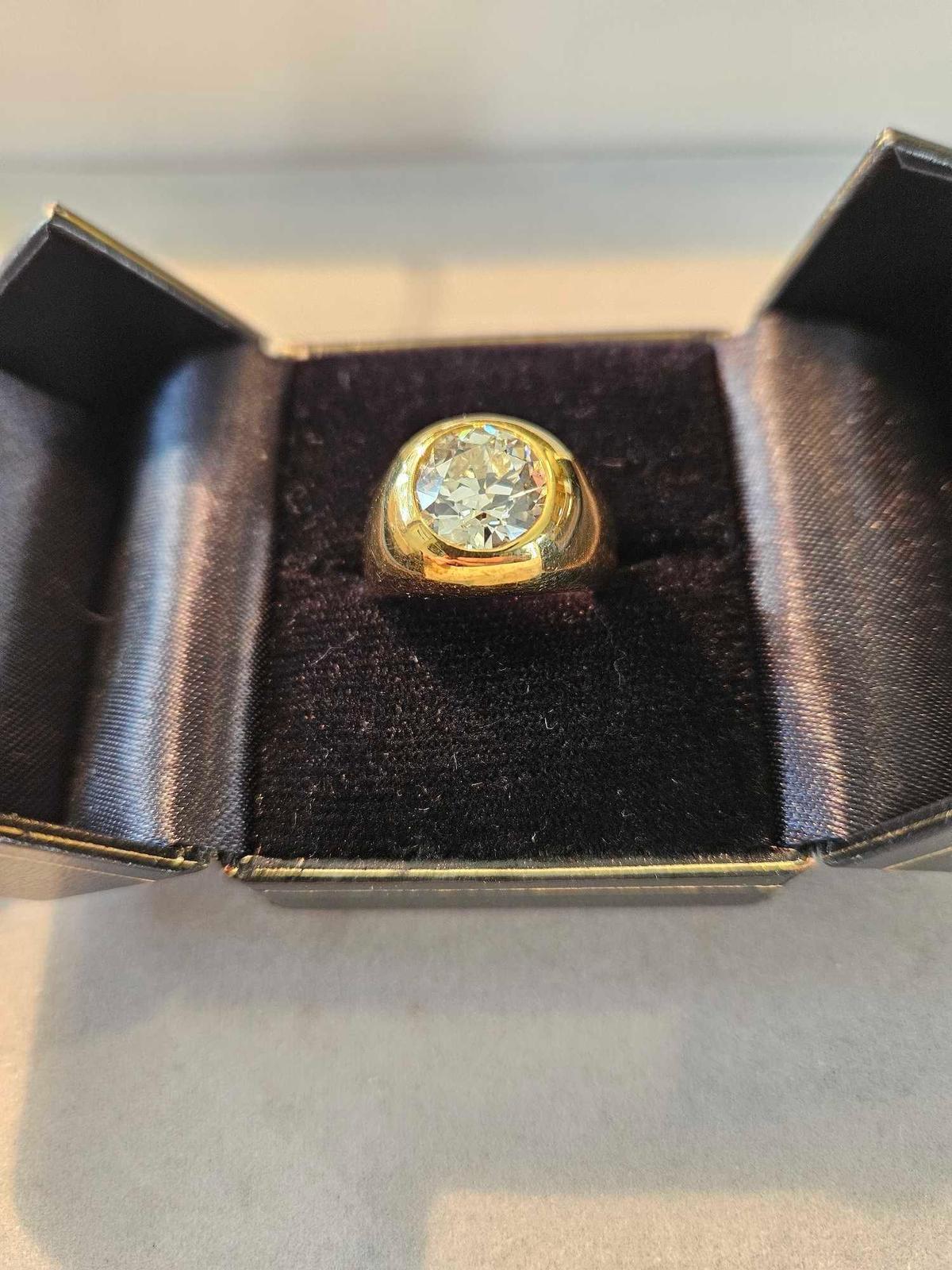 18k yellow gold ring with a round flush set Old European cut diamond 3 3/4 carat