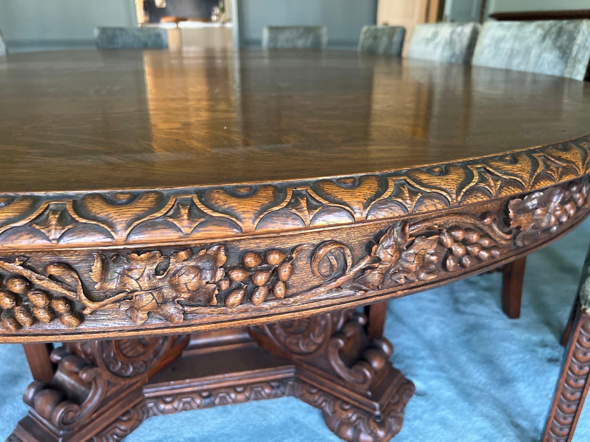 Late 1800s Heavily Carved Oak Dining Table with 10 Chairs
