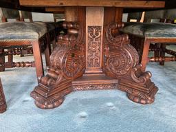 Late 1800s Heavily Carved Oak Dining Table with 10 Chairs