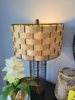 Wire frame style table lamp with decorative shade, artificial plant and candle holder